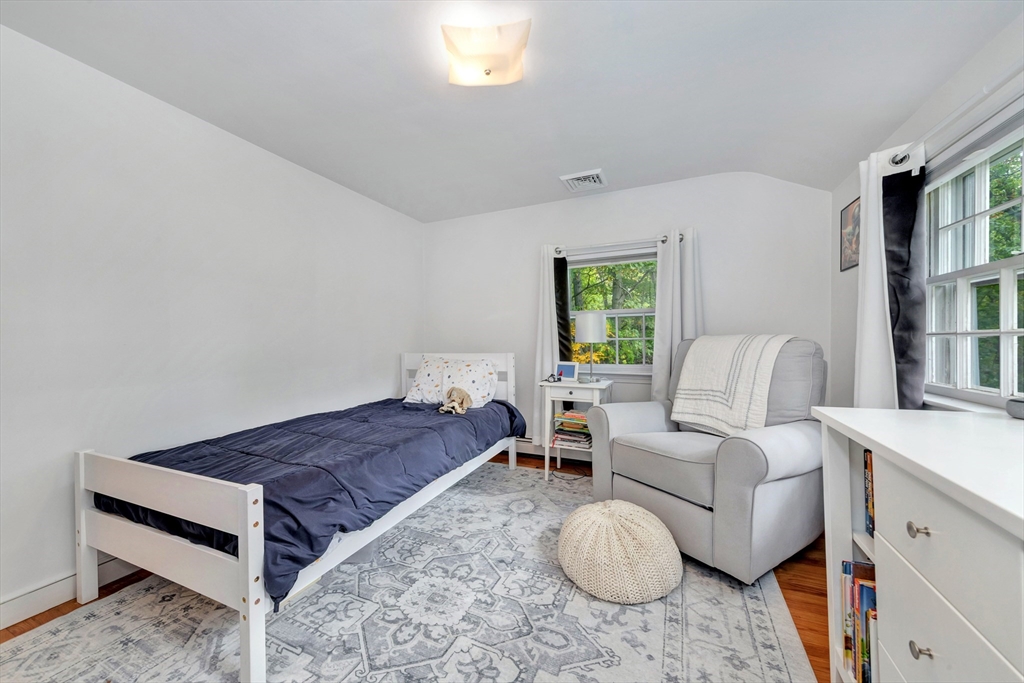 14 Hanson Street Dedham, MA 02026 - Photo 34 of 41 a living room with furniture a bed and a couch