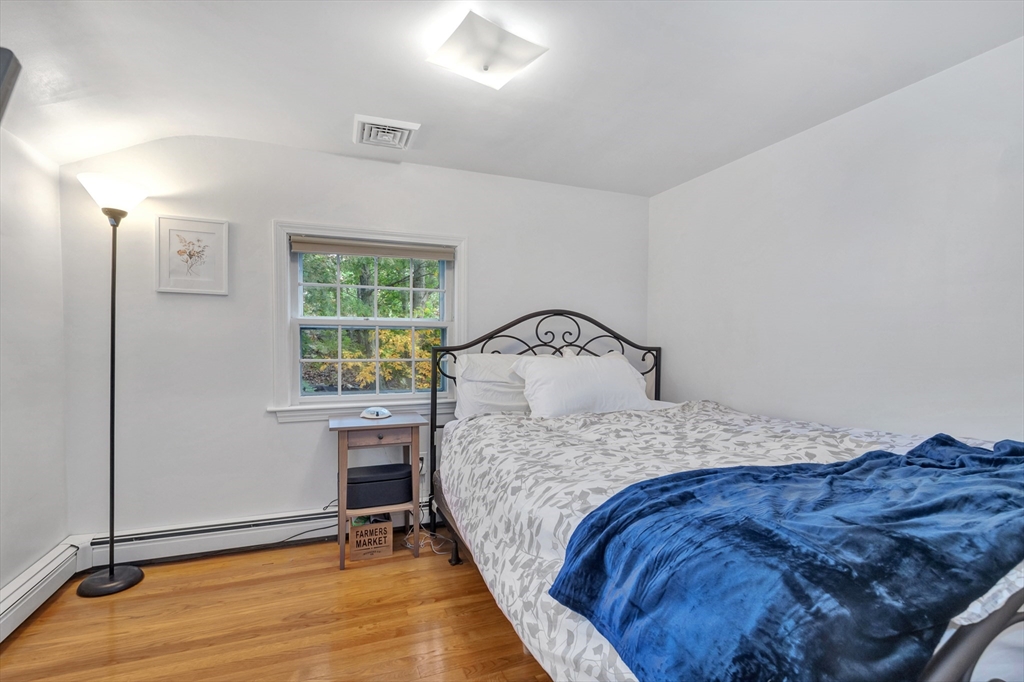 14 Hanson Street Dedham, MA 02026 - Photo 35 of 41 a bedroom with a bed and a window