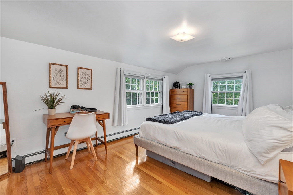 14 Hanson Street Dedham, MA 02026 - Photo 37 of 41 a bedroom with a bed and a chair