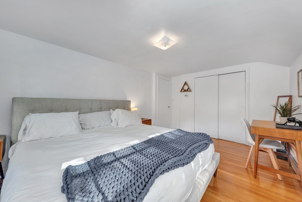 14 Hanson Street Dedham, MA 02026 - Photo 39 of 41 a bedroom with a bed and a table in it