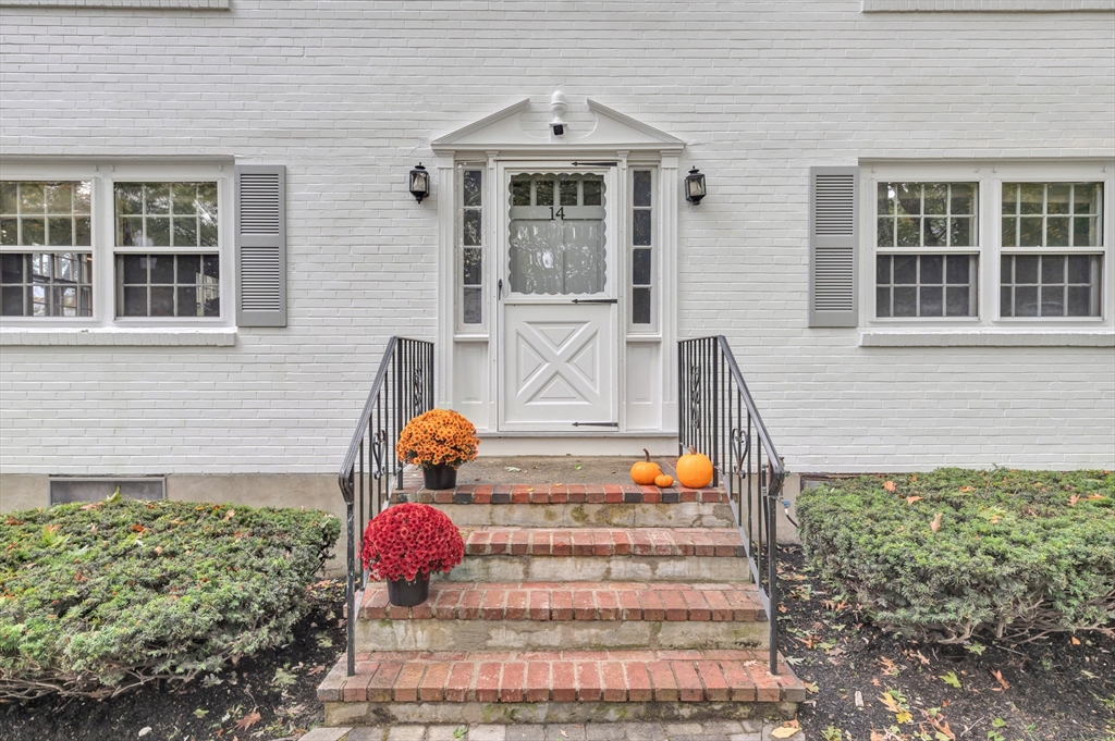 14 Hanson Street Dedham, MA 02026 - Photo 5 of 41 a front view of a house with outdoor seating and stairs