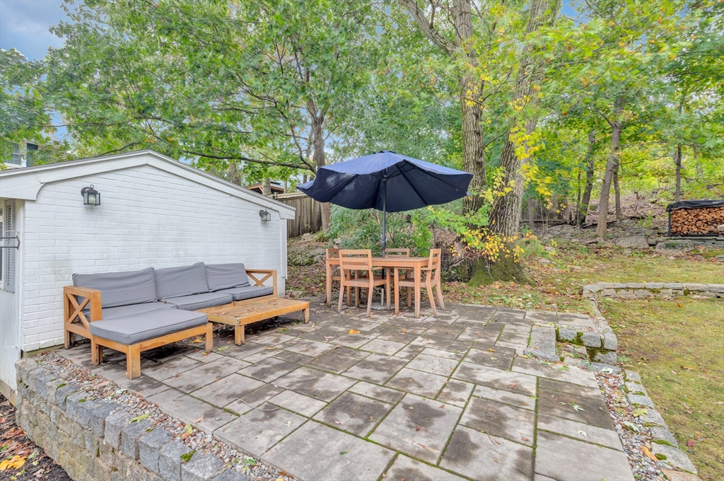 14 Hanson Street Dedham, MA 02026 - Photo 8 of 41 a backyard of a house with table and chairs