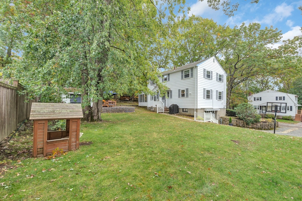 14 Hanson Street Dedham, MA 02026 - Photo 10 of 41 a view of a house with a yard and sitting area