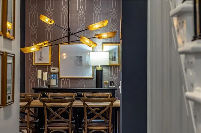 a view of a house with swimming pool and sitting area