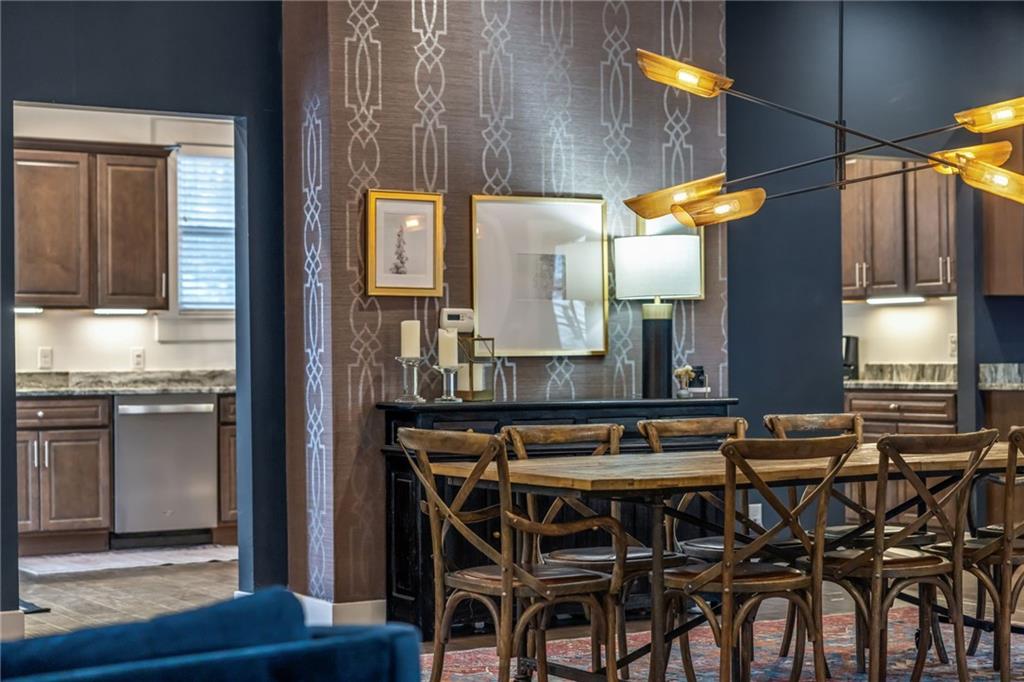 407 Hulton Road Oakmont, PA 15139 - Photo 17 of 50 Additional view of the dining area complete with modern light fixture and wallpaper accent wall