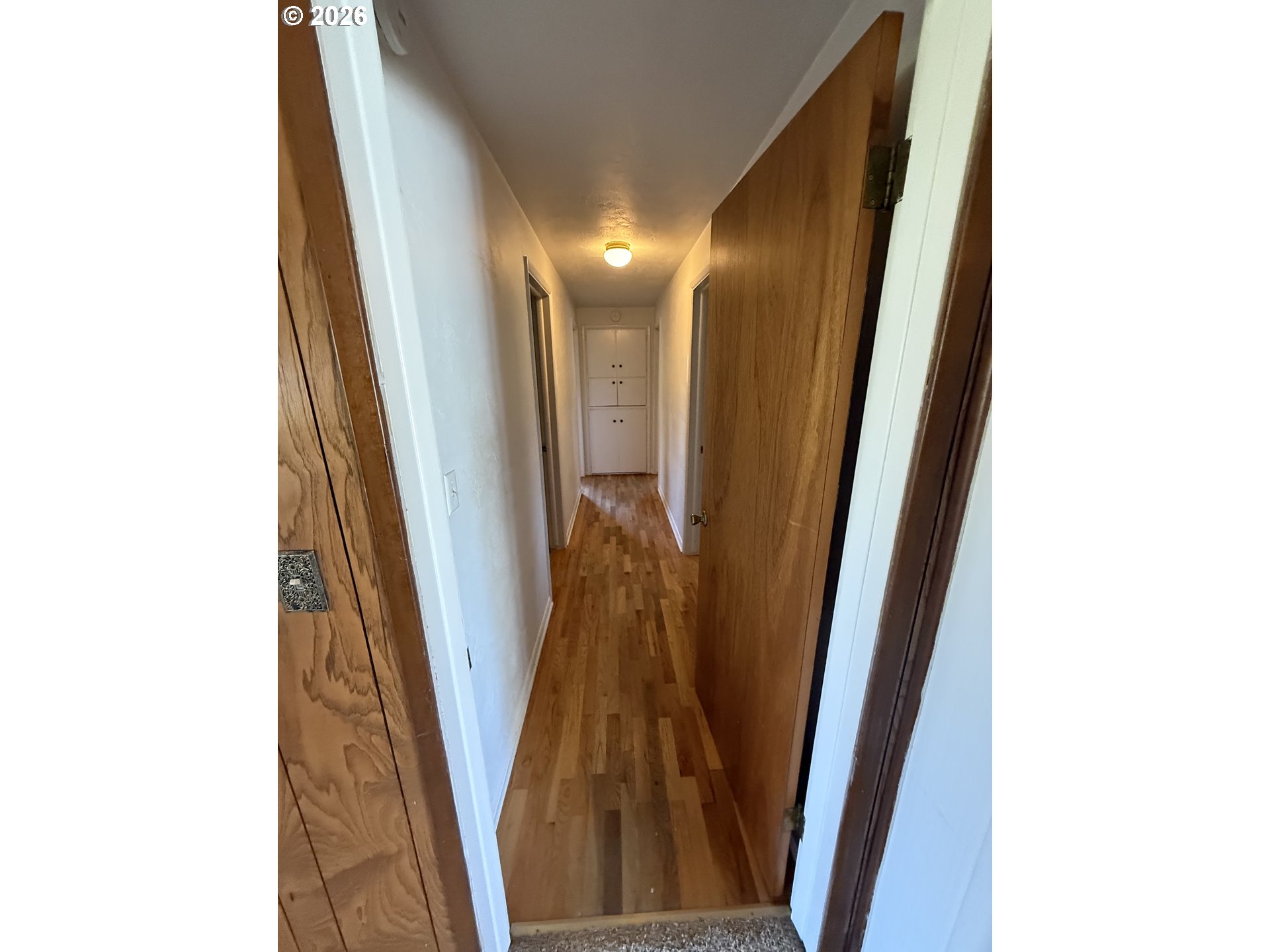 349 Van Duyn Street Eugene, OR 97401 - Photo 13 of 24 a view of a hallway with wooden floor