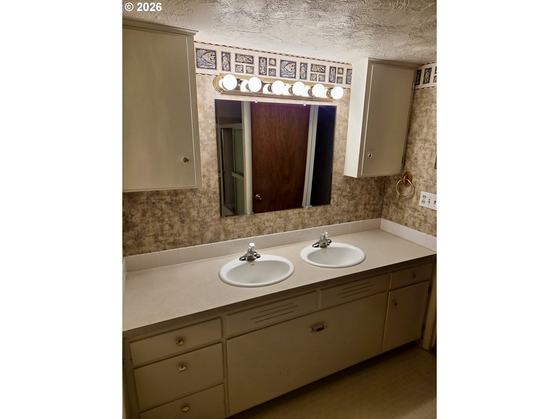 349 Van Duyn Street Eugene, OR 97401 - Photo 15 of 24 a bathroom with a sink and a mirror
