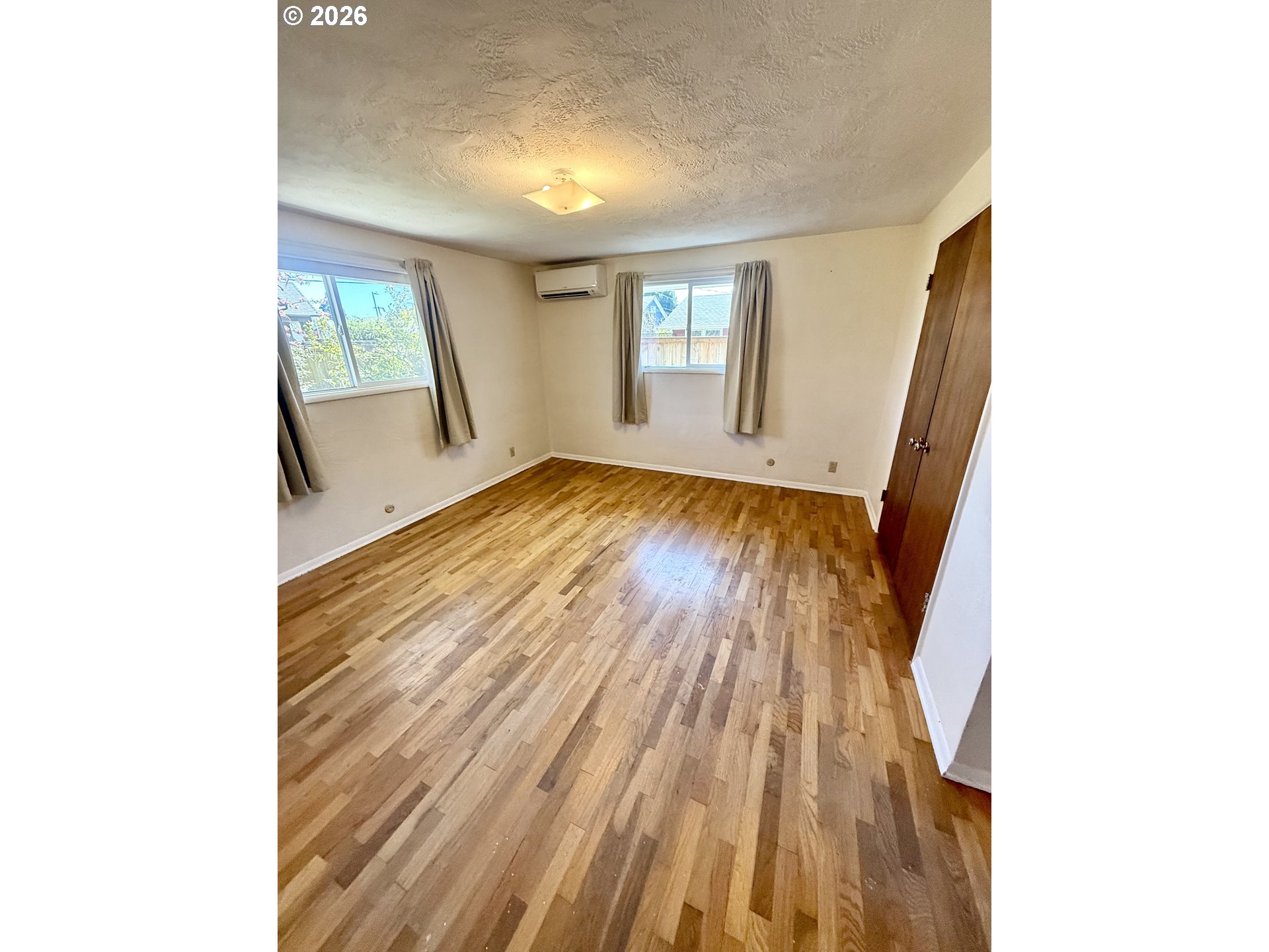 349 Van Duyn Street Eugene, OR 97401 - Photo 17 of 24 a view of a room with wooden floor and a window
