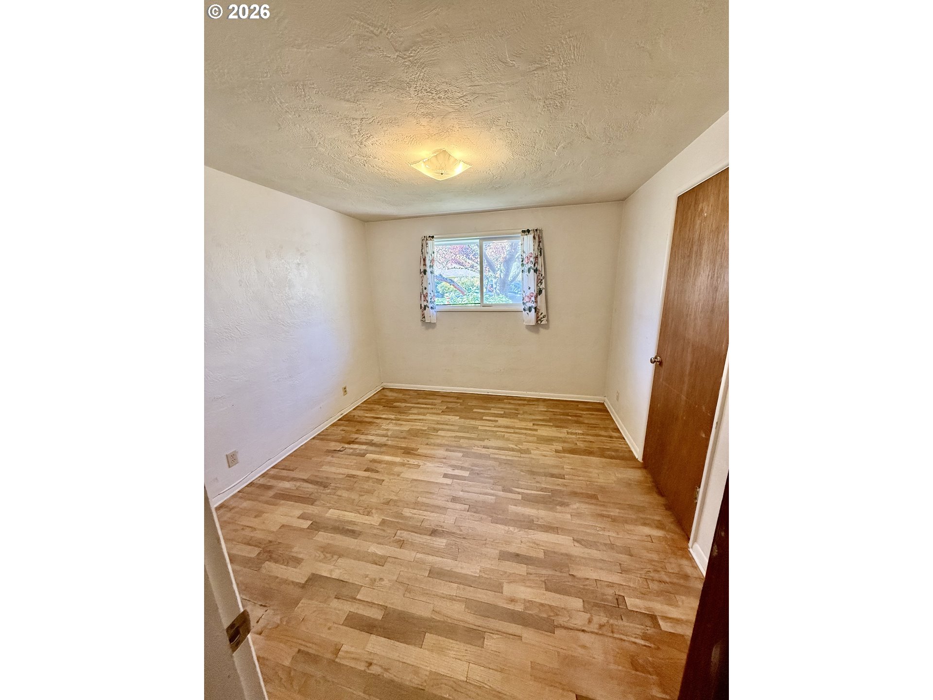 349 Van Duyn Street Eugene, OR 97401 - Photo 22 of 24 a view of a hallway with wooden floor