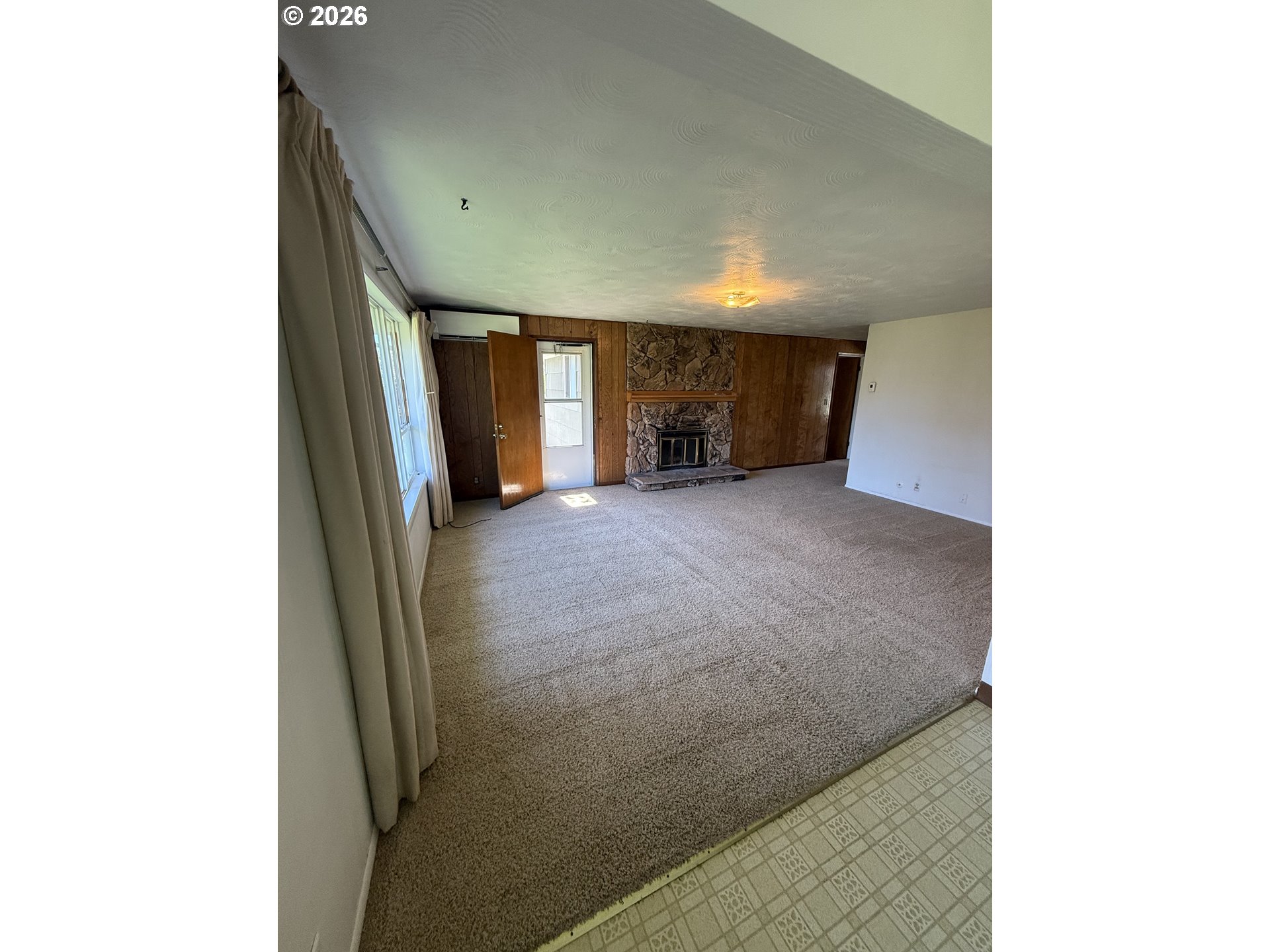 349 Van Duyn Street Eugene, OR 97401 - Photo 5 of 24 a view of a big room with windows and cabinet