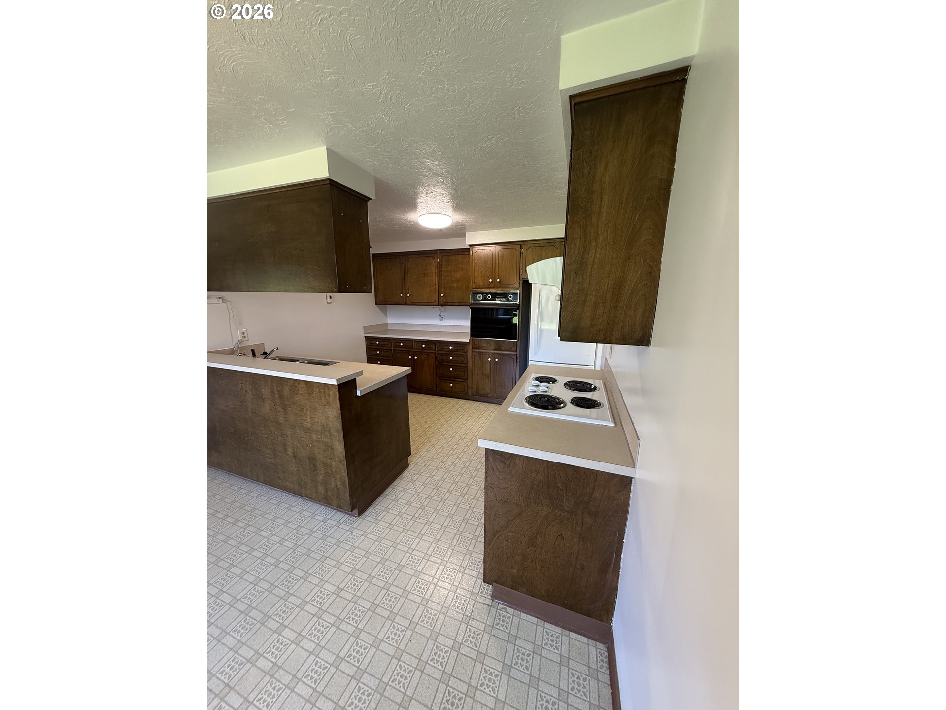 349 Van Duyn Street Eugene, OR 97401 - Photo 8 of 24 a kitchen with a sink cabinets and stainless steel appliances