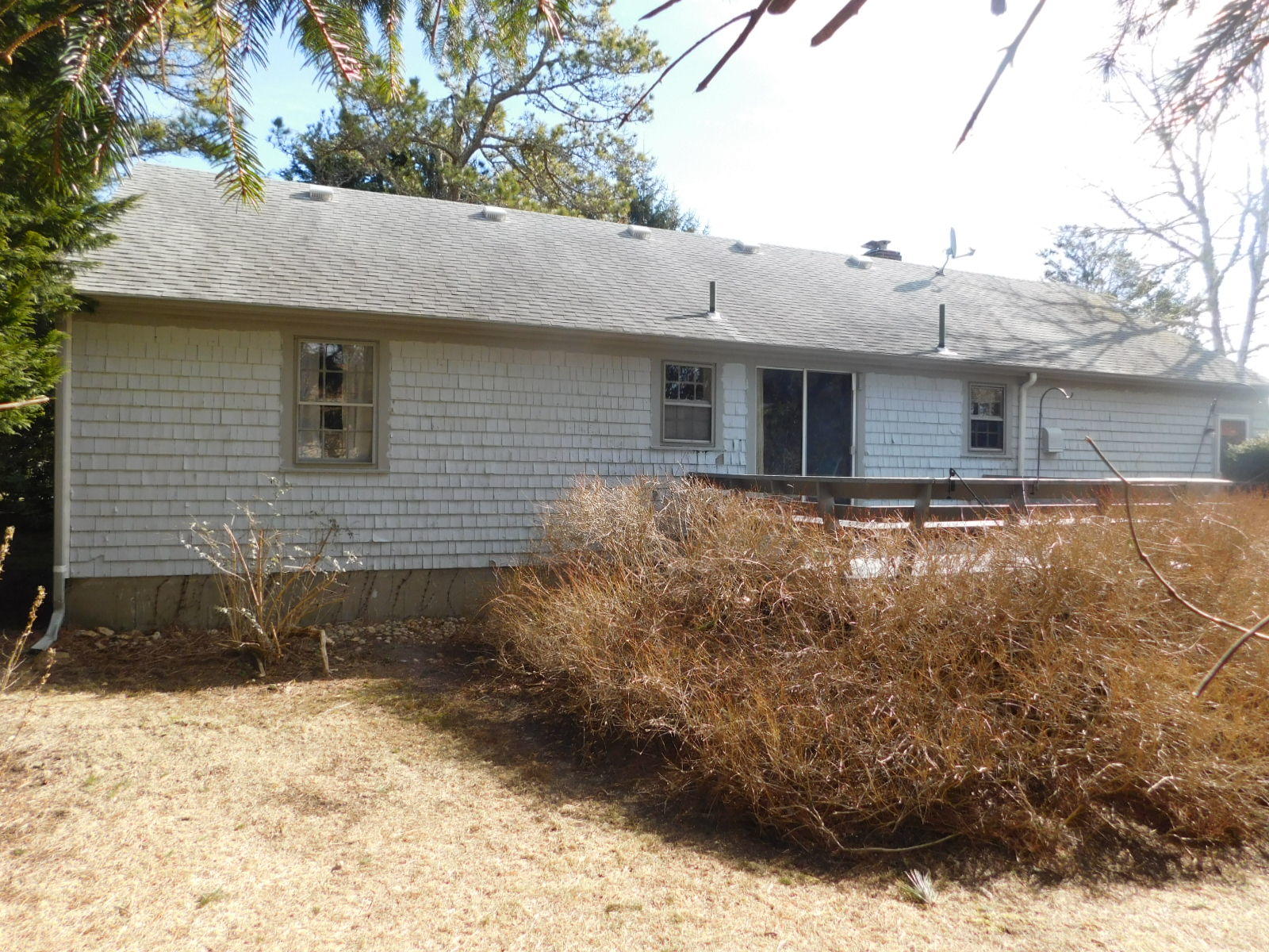 79 Joan Road Centerville, MA 02632 - Photo 3 of 4 a front view of a house with a yard