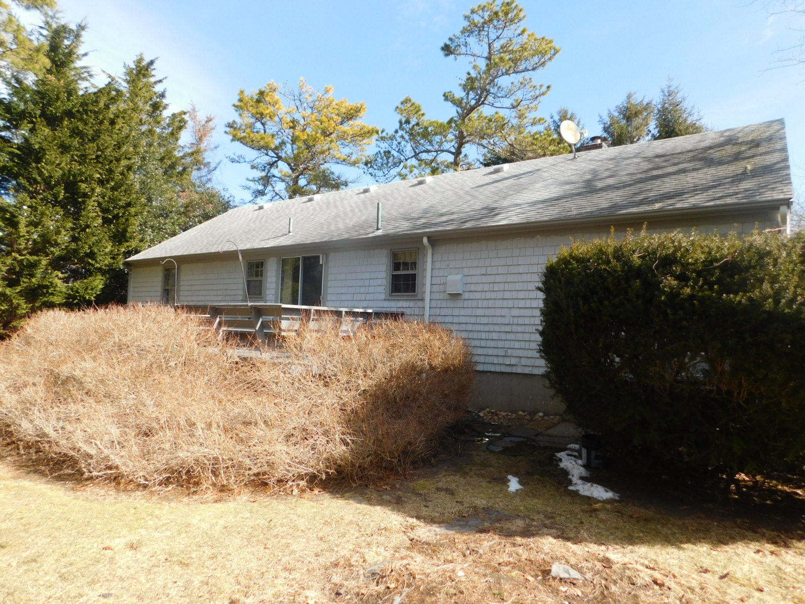 79 Joan Road Centerville, MA 02632 - Photo 4 of 4 a front view of a house with a yard