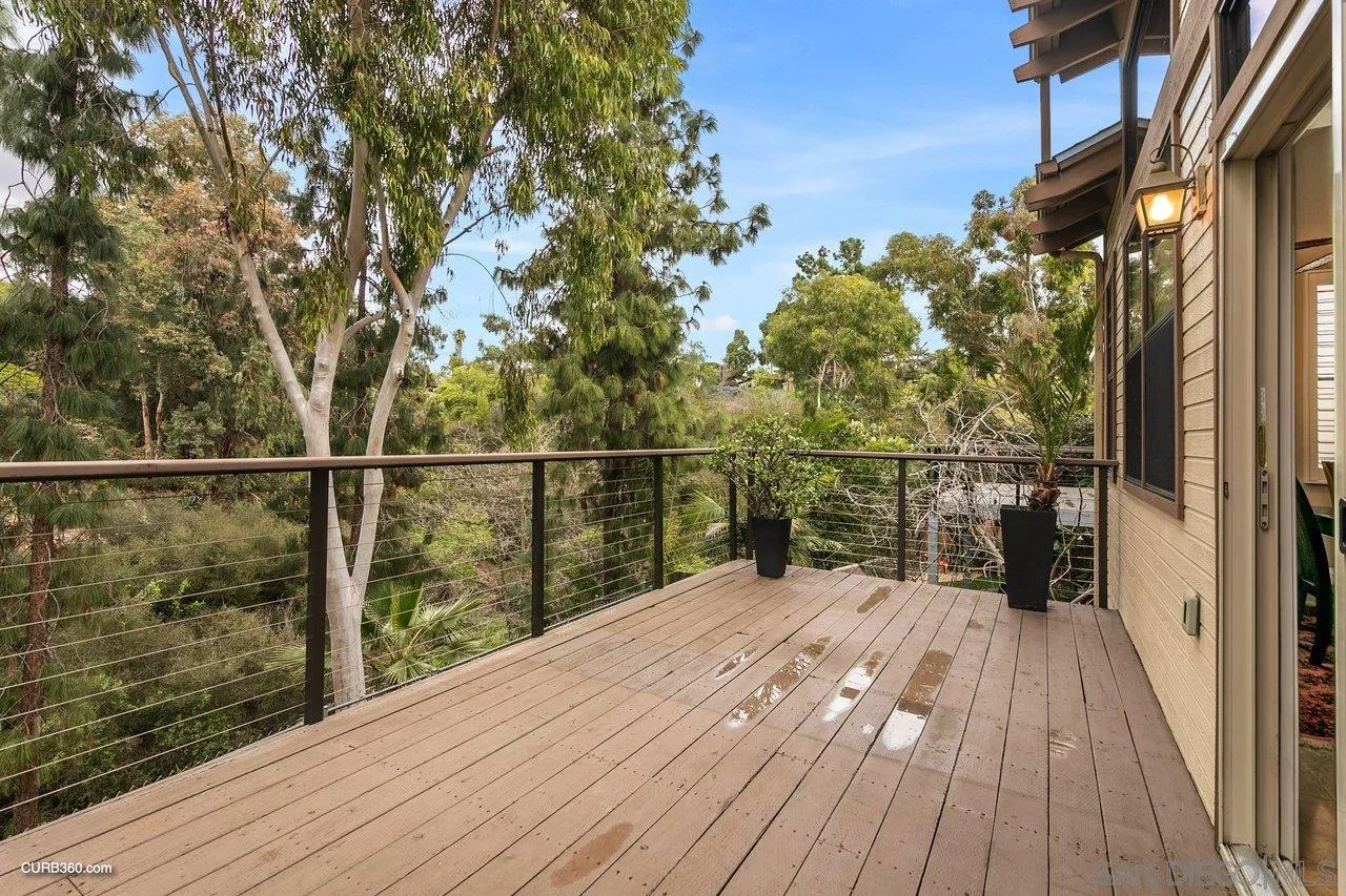 4579 54th Street San Diego, CA 92115 - Photo 11 of 39 a view of balcony with wooden floor and fence