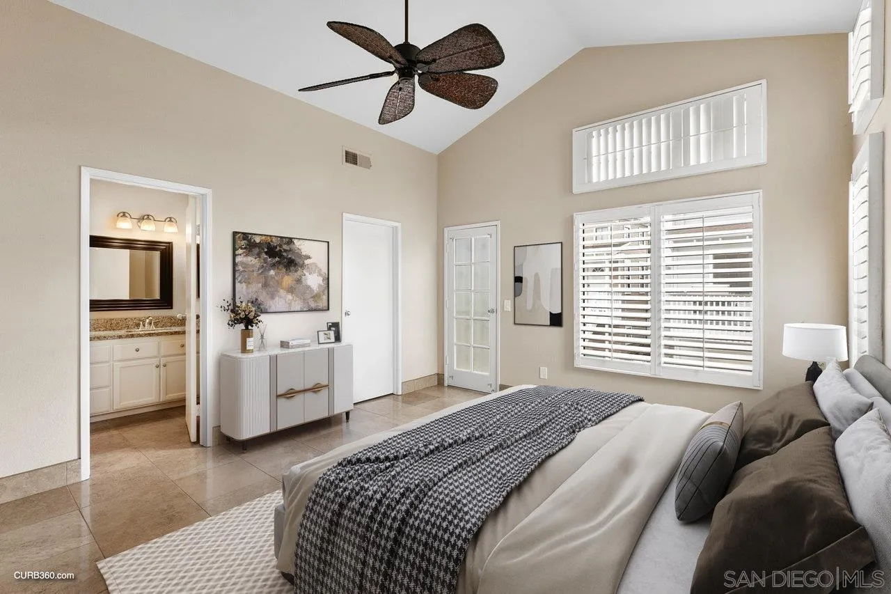 4579 54th Street San Diego, CA 92115 - Photo 18 of 39 a bedroom with a bed a couch and a window