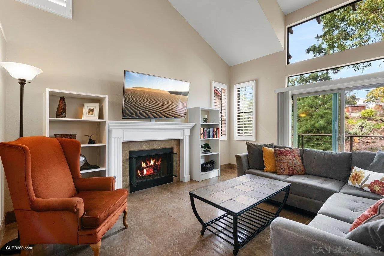 4579 54th Street San Diego, CA 92115 - Photo 2 of 39 a living room with furniture and a fireplace