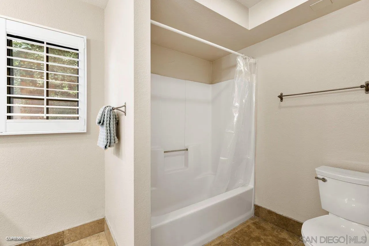 4579 54th Street San Diego, CA 92115 - Photo 34 of 39 a bathroom with a shower and a toilet