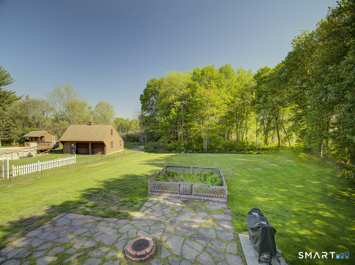 82 Wilcox Road Middletown, CT 06457 - Photo 7 of 27 a view of a garden with lawn chairs