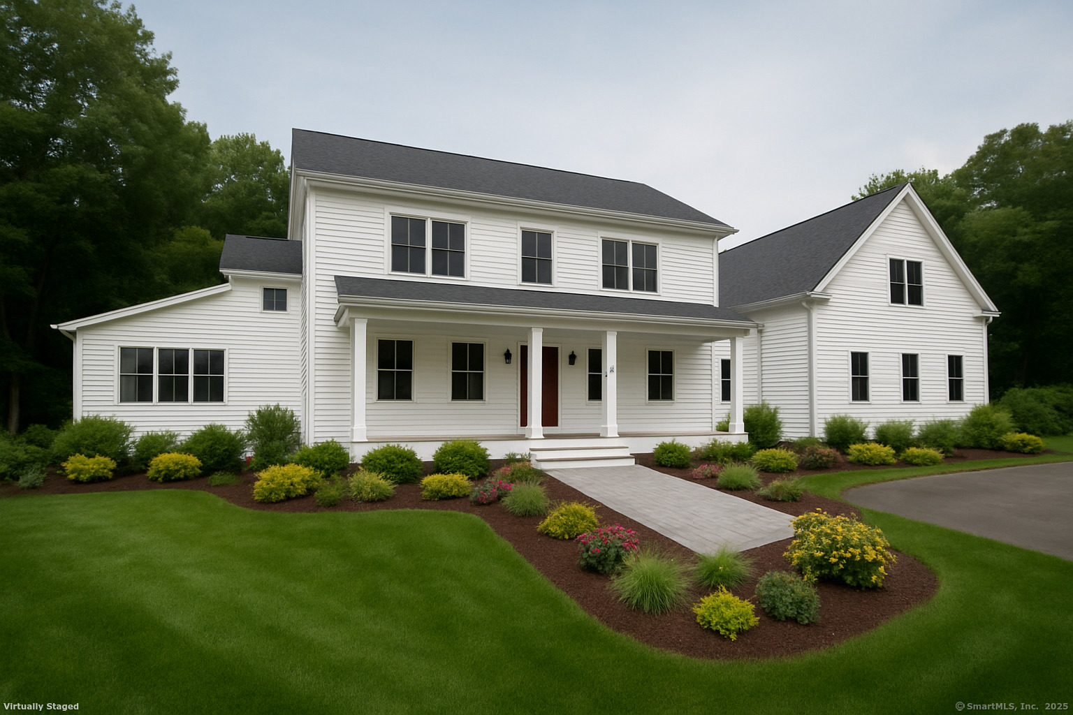 a front view of a house with a garden and plants