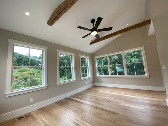 a view of room window and wooden floor