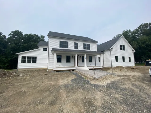 a house with trees in the background