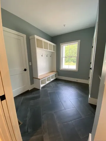 a view of an empty room with a window