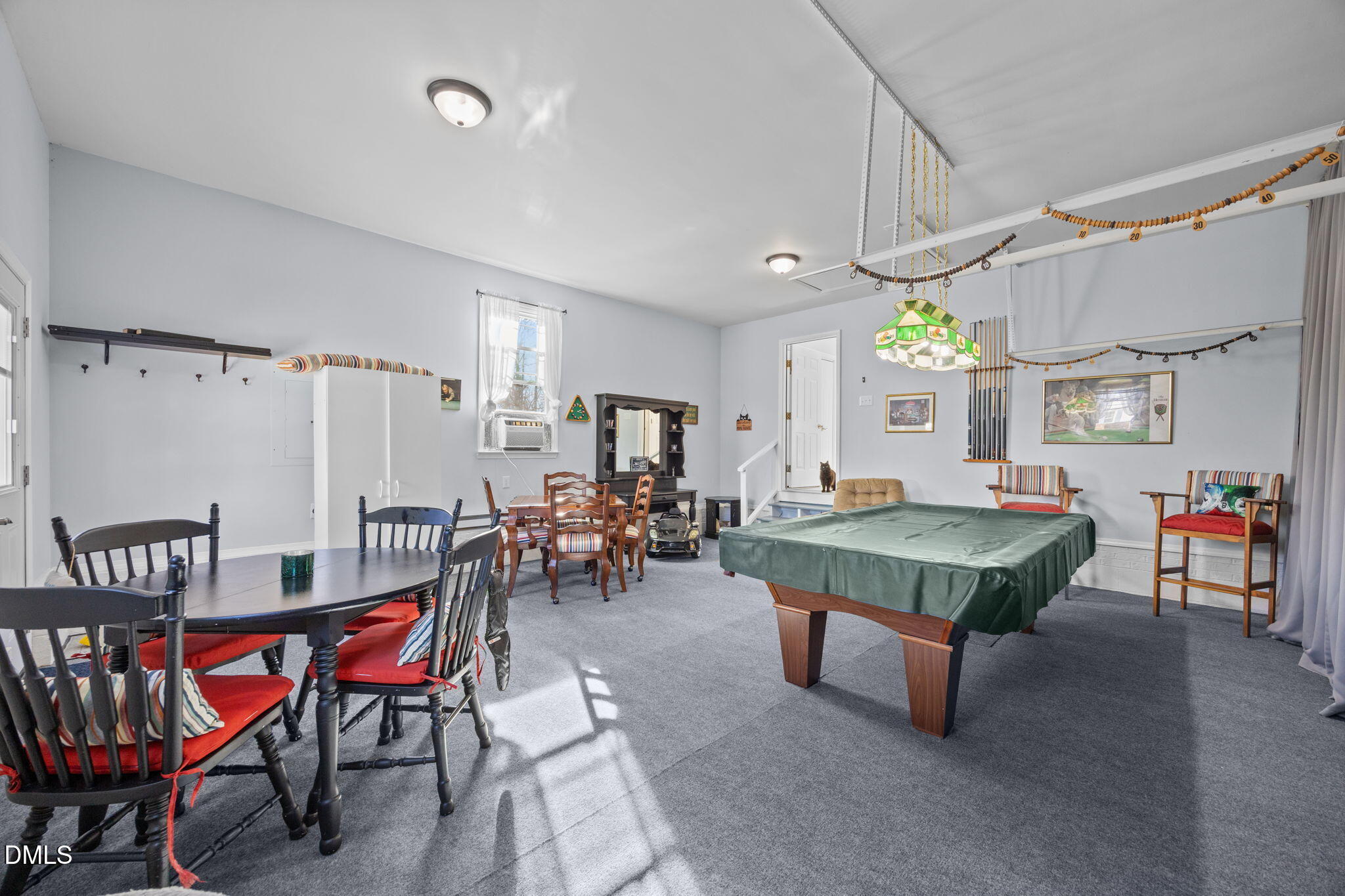 6194 Friedens Grove Road Gibsonville, NC 27249 - Photo 11 of 23 a room with lots of furniture and a wooden floor