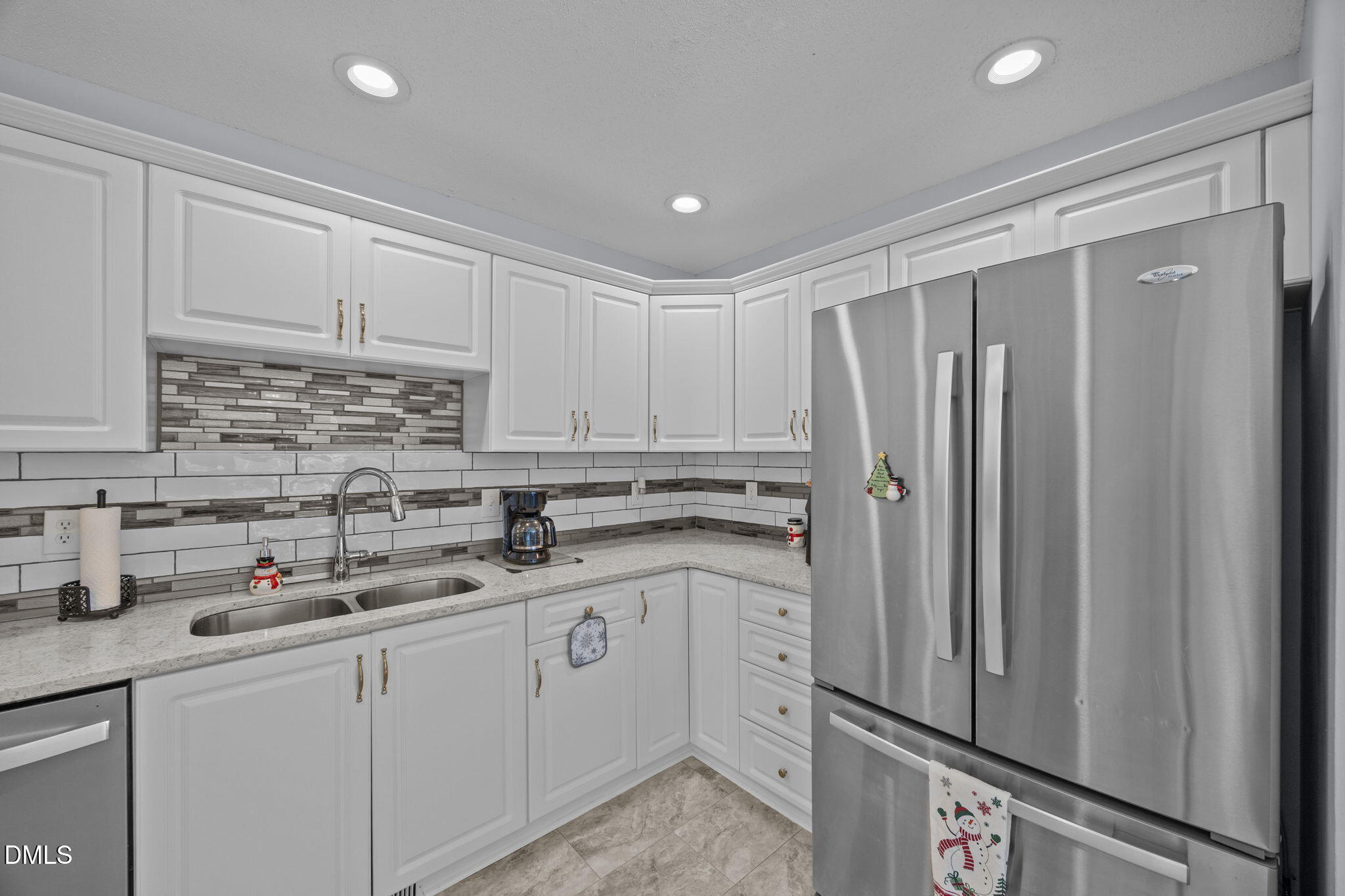 6194 Friedens Grove Road Gibsonville, NC 27249 - Photo 14 of 23 a kitchen with stainless steel appliances granite countertop a refrigerator sink and cabinets