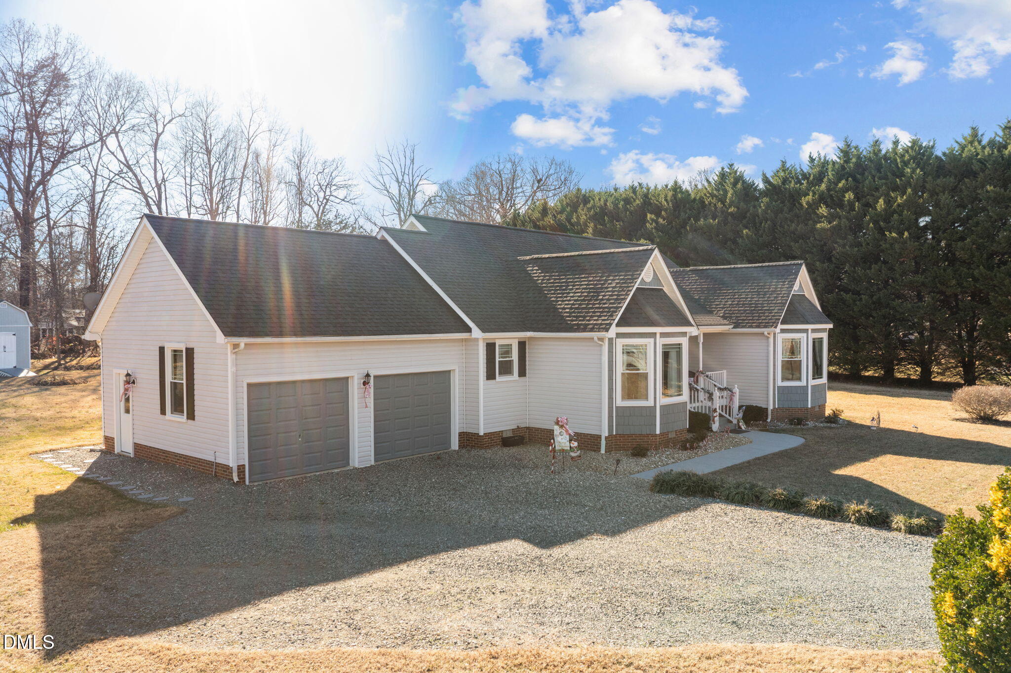 6194 Friedens Grove Road Gibsonville, NC 27249 - Photo 2 of 23 a view of a white house with a yard