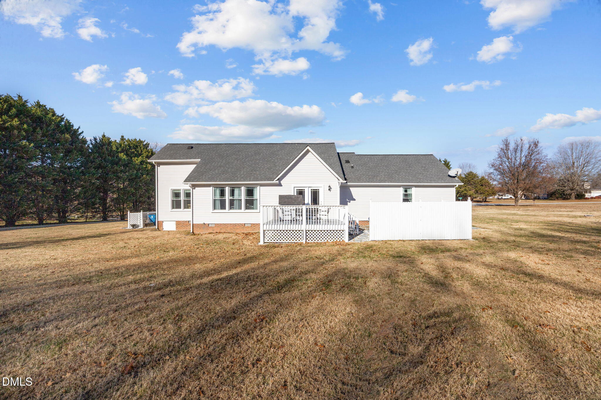 6194 Friedens Grove Road Gibsonville, NC 27249 - Photo 22 of 23 a view of white house with a big yard and large trees