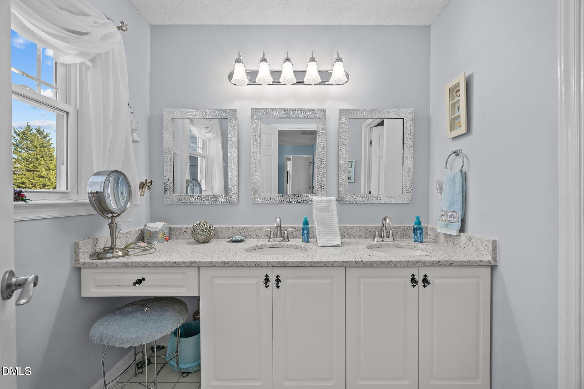 6194 Friedens Grove Road Gibsonville, NC 27249 - Photo 5 of 23 a bathroom with double vanity sinks and a mirror
