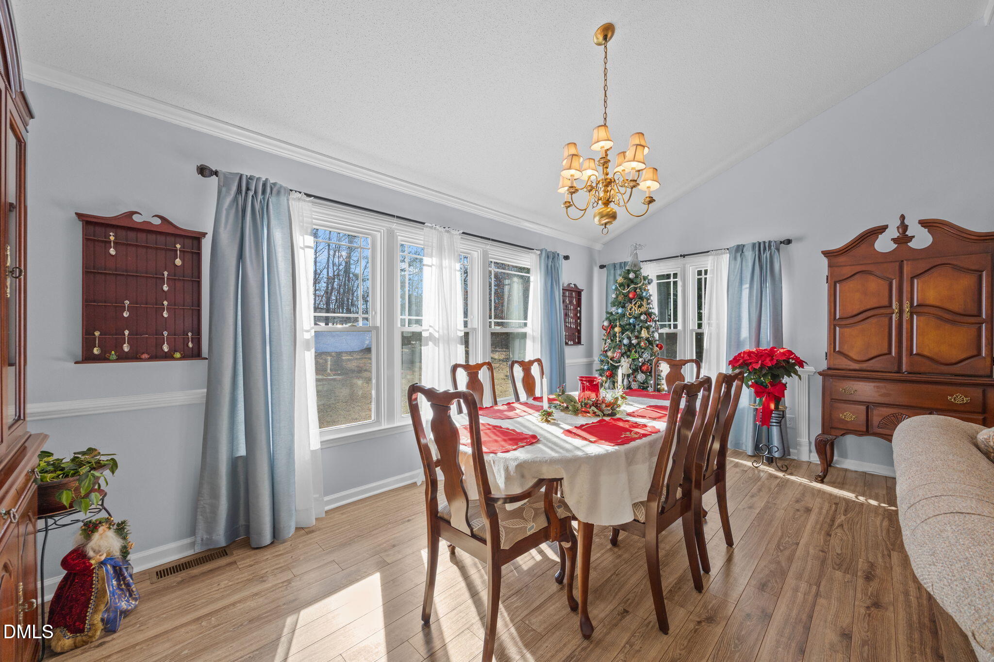 6194 Friedens Grove Road Gibsonville, NC 27249 - Photo 10 of 23 a view of a dining room with furniture window and wooden floor