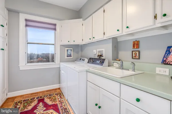 a kitchen with sink and cabinets