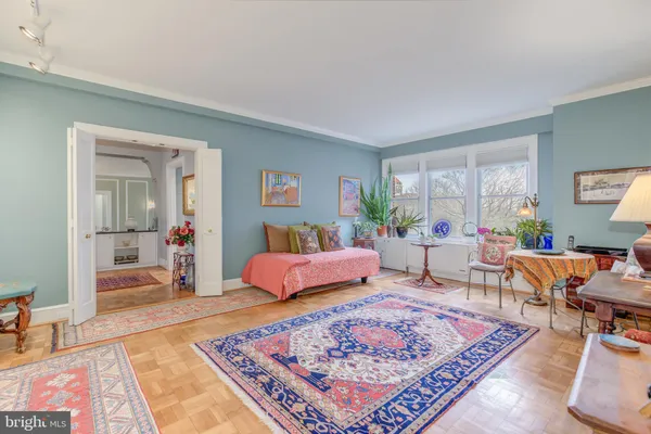 a living room with furniture rug and window