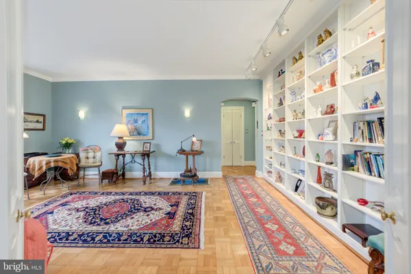 a living room with furniture and a rug