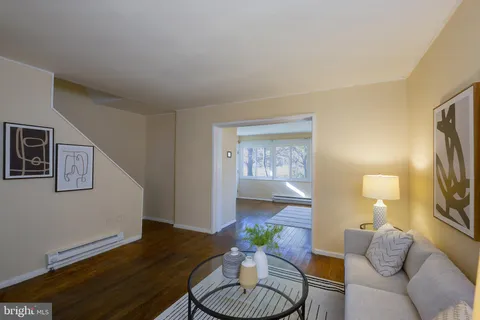 a living room with furniture and a table