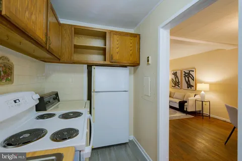 a view of a kitchen cabinets and a wooden floor