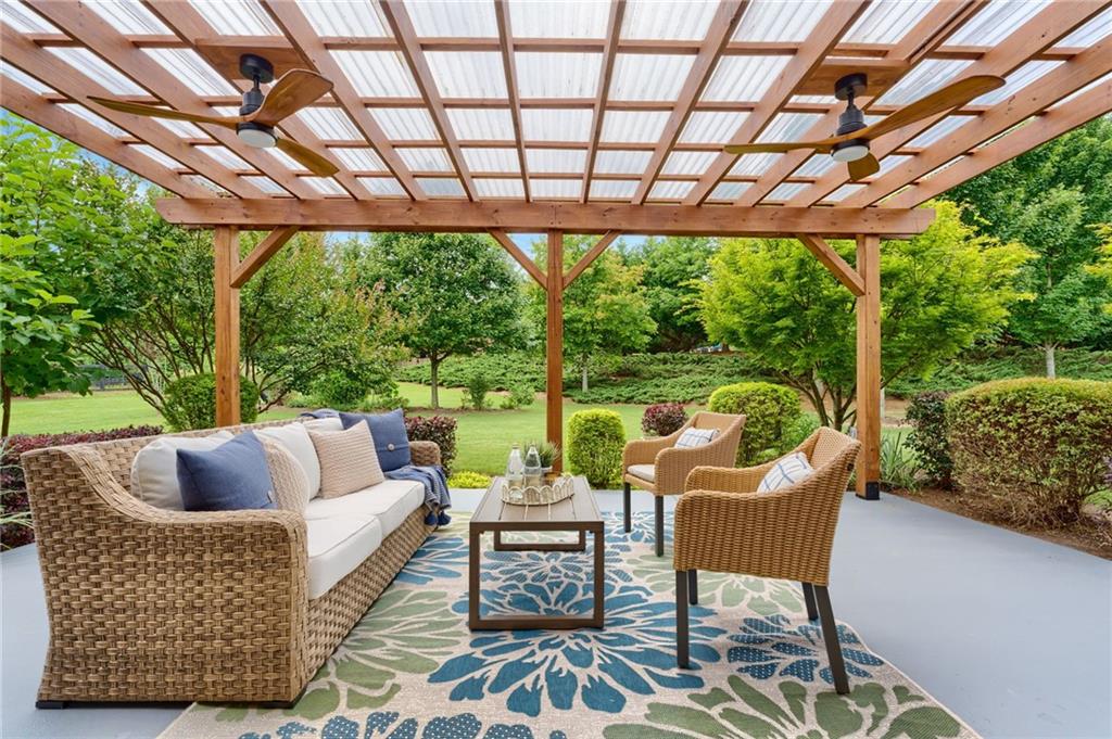 4735 Amble Trace Cumming, GA 30040 - Photo 3 of 73 a outdoor living space with furniture and garden view