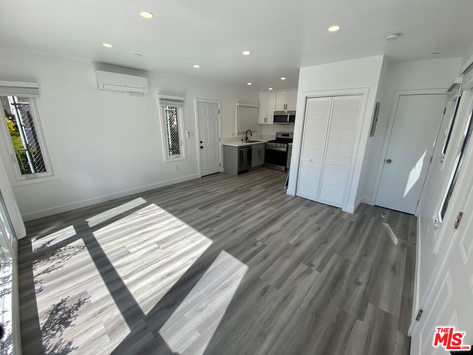 1217 9th Street, Unit 1 Santa Monica, CA 90401 - Photo 11 of 21 a view of kitchen and wooden floor