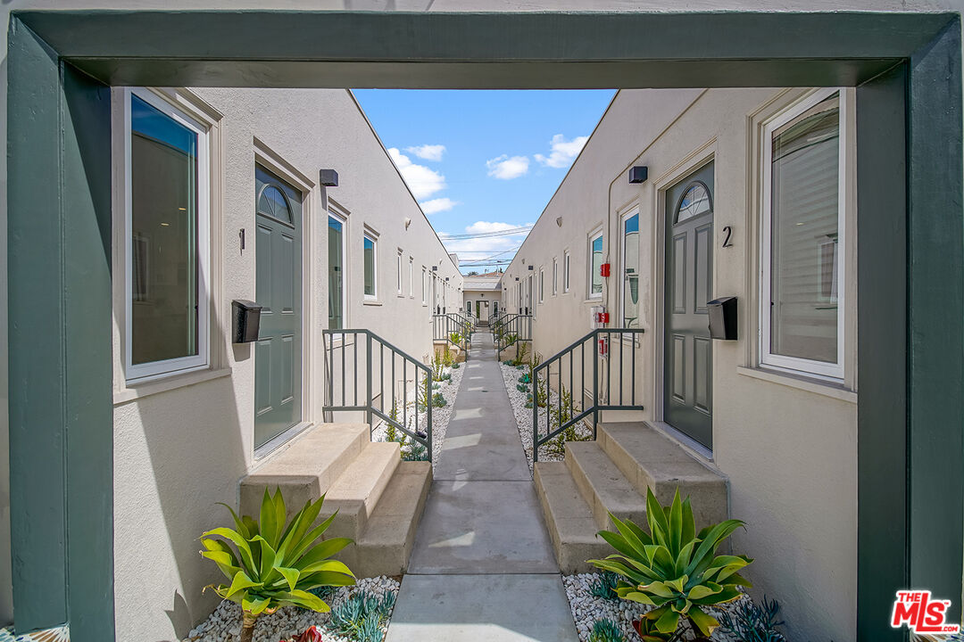 1217 9th Street, Unit 1 Santa Monica, CA 90401 - Photo 3 of 21 a view of a hallway with flower pots