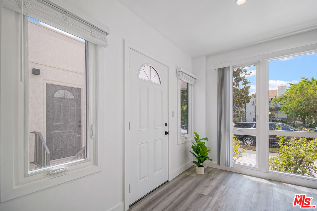 1217 9th Street, Unit 1 Santa Monica, CA 90401 - Photo 6 of 21 a view of an entryway with wooden floor