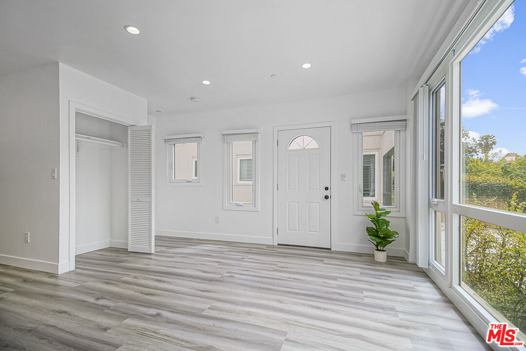1217 9th Street, Unit 1 Santa Monica, CA 90401 - Photo 7 of 21 a view of hallway with wooden floor