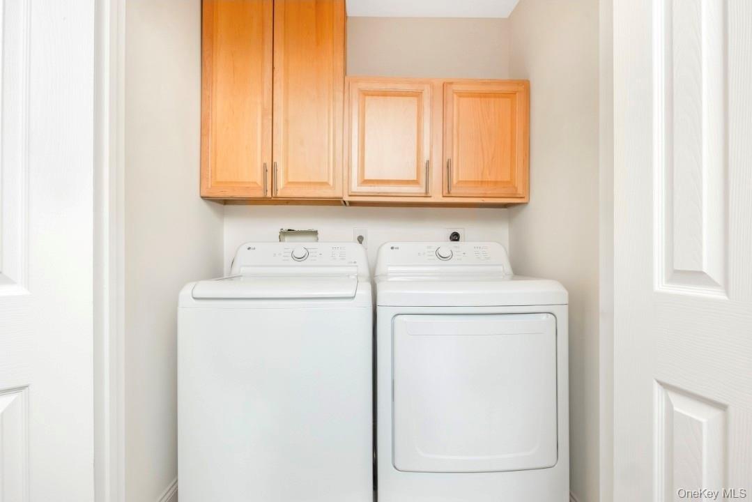 59 Nelson Road Selden, NY 11784 - Photo 22 of 38 Washroom featuring cabinet space and washer and clothes dryer
