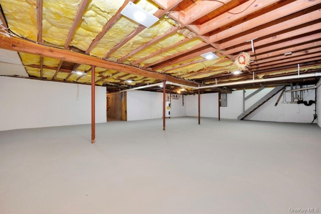 59 Nelson Road Selden, NY 11784 - Photo 29 of 38 Unfinished basement with electric panel