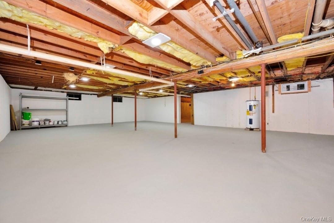 59 Nelson Road Selden, NY 11784 - Photo 35 of 38 Unfinished basement with electric water heater