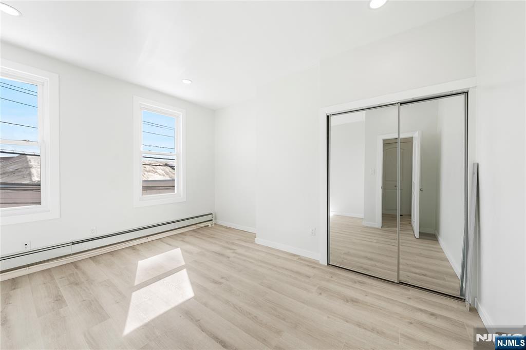 600 67th Street West New York, NJ 07093 - Photo 7 of 12 wooden floor in an empty room with a window