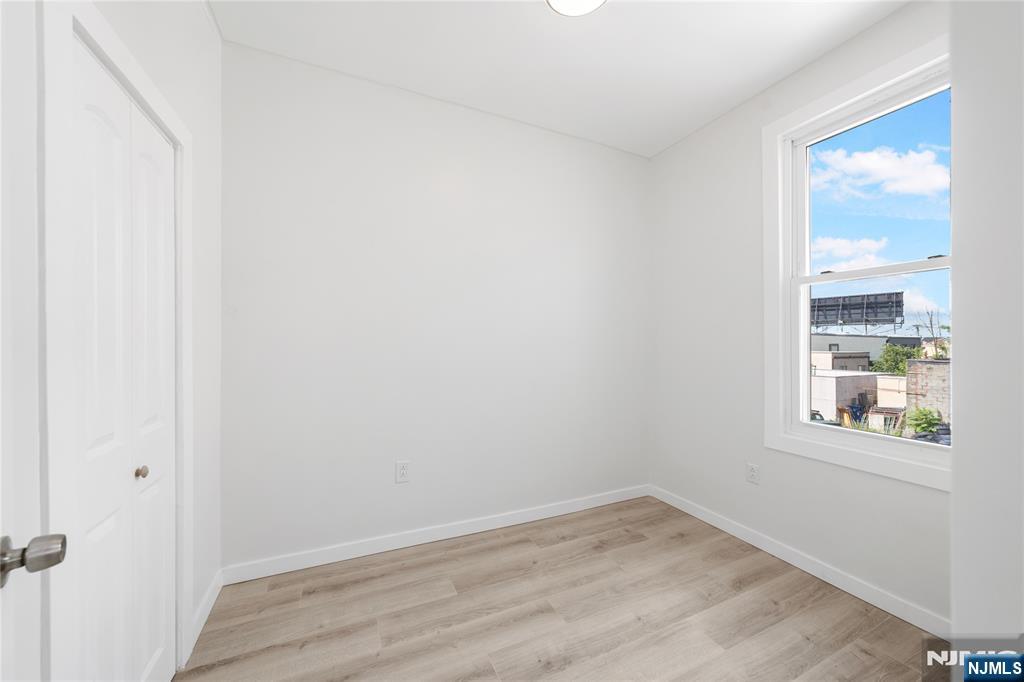 600 67th Street West New York, NJ 07093 - Photo 10 of 12 an empty room with a window