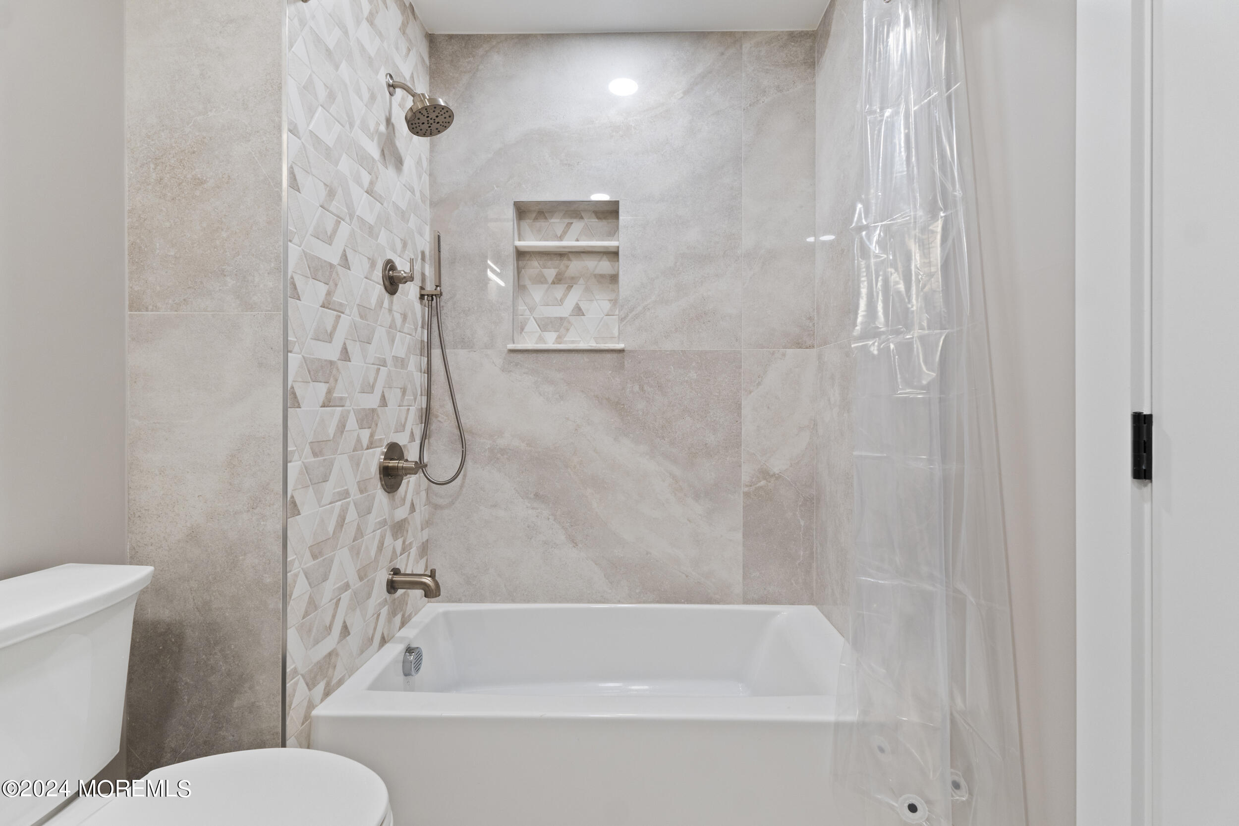 40 Seaview Avenue, Unit B Long Branch, NJ 07740 - Photo 16 of 81 a bathroom with a bathtub and a toilet