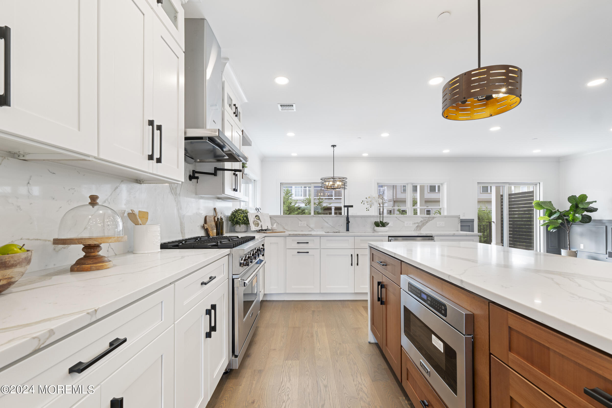 40 Seaview Avenue, Unit B Long Branch, NJ 07740 - Photo 27 of 81 a kitchen with stainless steel appliances granite countertop a lot of counter space and wooden floors