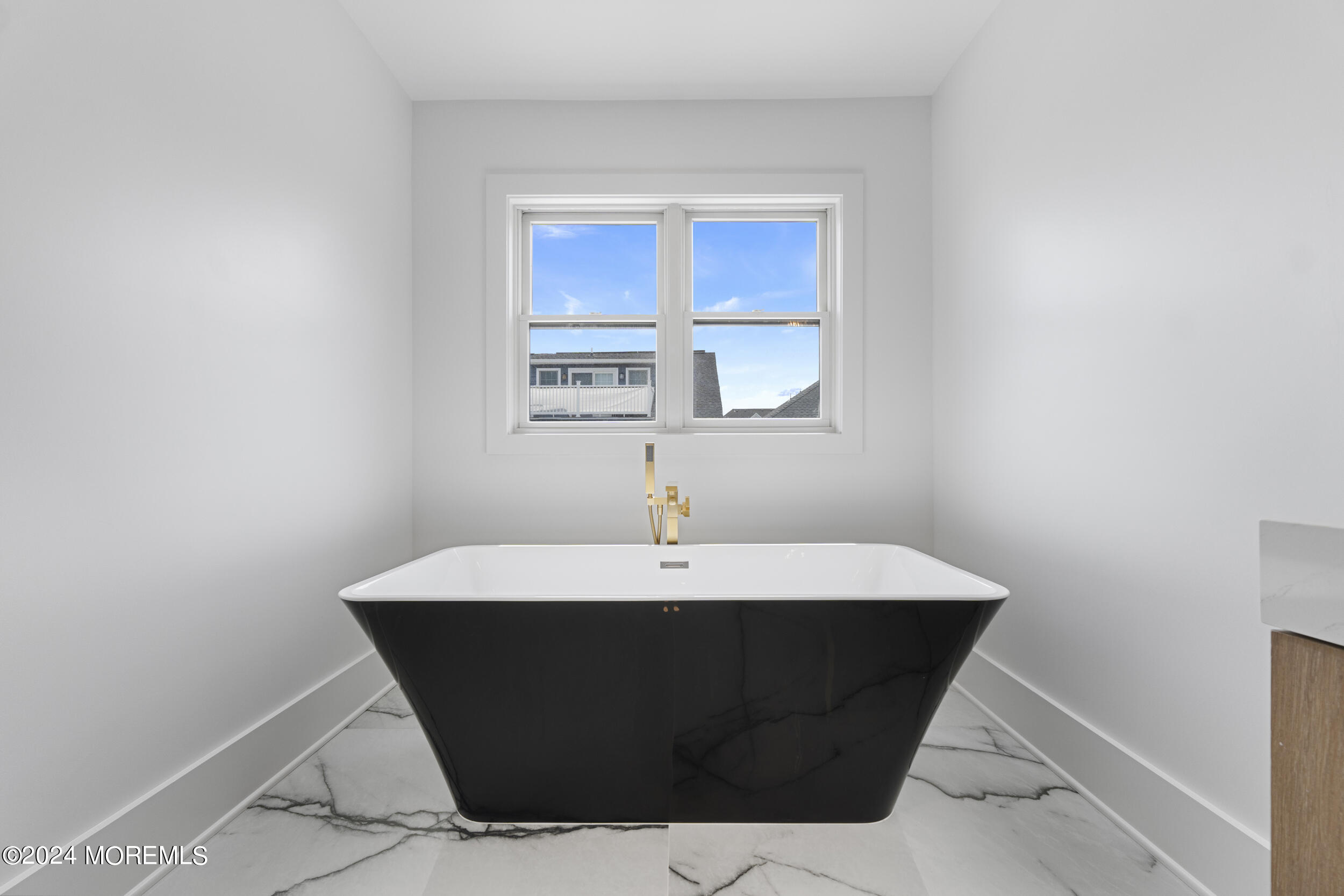 40 Seaview Avenue, Unit B Long Branch, NJ 07740 - Photo 49 of 81 a white bath tub sitting in a bathroom